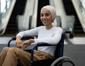 Woman in wheel chair smiling at camera